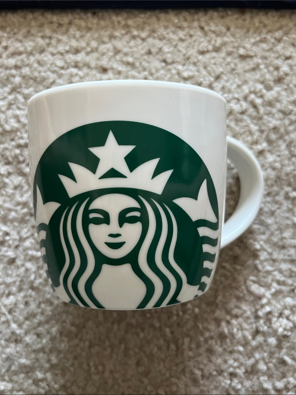 Starbucks classic white ceramic mug with the green Siren logo. 14oz